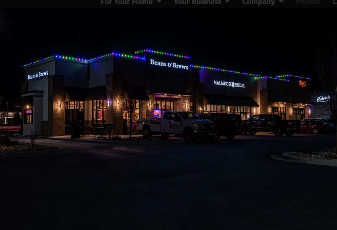 row of commercial buildings with commercial permanent exterior lighting
